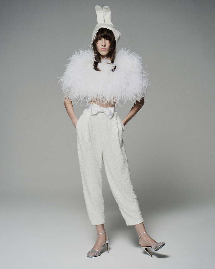 Брюки из ткани, расшитой пайетками, с атласным бантом