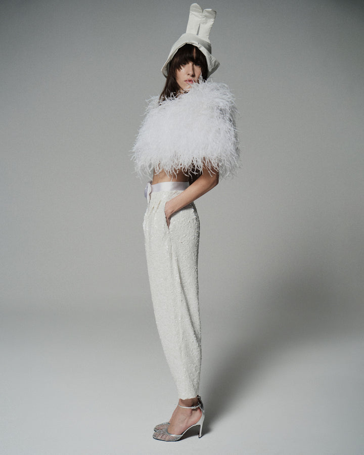 Брюки из ткани, расшитой пайетками, с атласным бантом